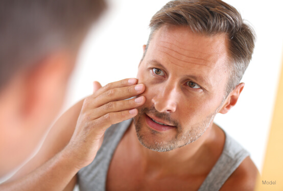 Man looking at himself in the mirror