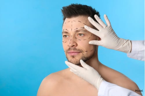 Doctor examining mans face before Endoscopic Brow Lift