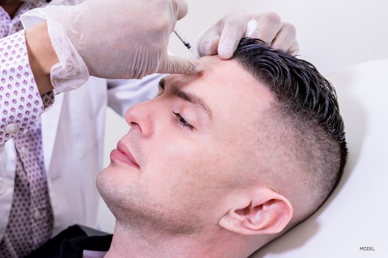 Man getting BOTOX® Cosmetic injected into forehead
