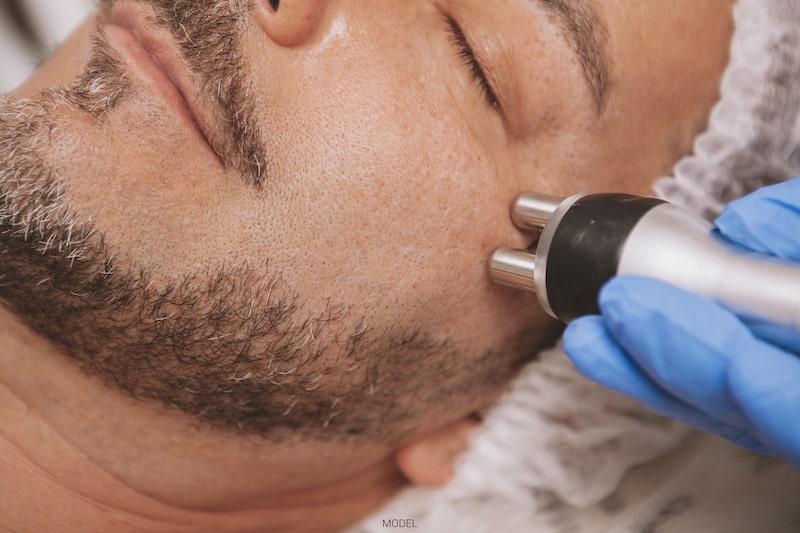 A man receives an anti-aging cosmetic treatment.