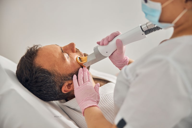 A man receives pulsed light laser treatment.